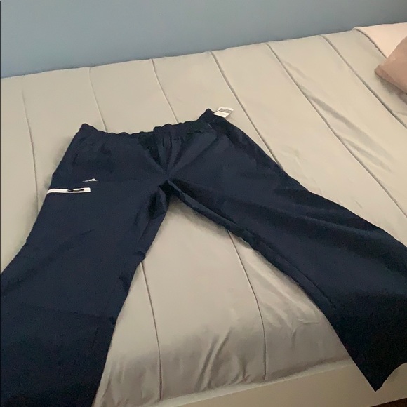 WOMENS ADIDAS CLIMAPROOF®️ Wind PANTS NAVY BLUE - Picture 2 of 8